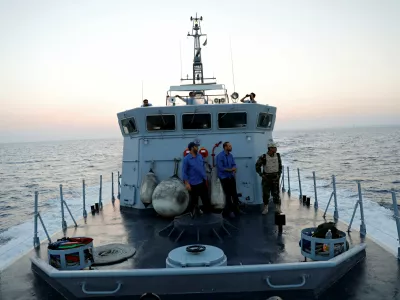 Members of the Libyan Coast Guard search for migrants off the coast of Tripoli, Libya, August 9, 2017. REUTERS/Hani Amara