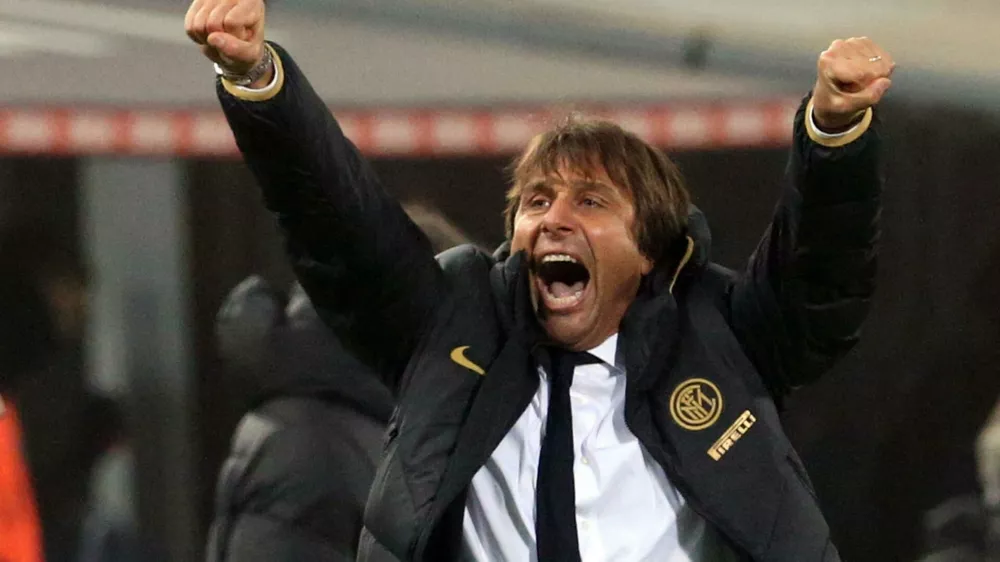 Inter coach Antonio Conte celebrates his team's victory at the end of the Italian Serie A soccer match between Bologna and Inter Milan at the Renato Dall'Ara stadium in Bologna, Italy, Saturday, Nov. 2, 2019. (Giorgio Benvenuti/ANSA via AP)
