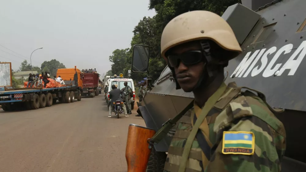 African peace keeping soldiers escort a humanitarian convoy in Bangui, February 15, 2014. France said on Friday it plans to send another 400 troops to help combat a crisis in the Central African Republic as U.N. chief Ban Ki-moon pleaded for more swift, robust international help to stop sectarian violence that could turn into a genocide. REUTERS/Luc Gnago (CENTRAL AFRICAN REPUBLIC - Tags: POLITICS CIVIL UNREST MILITARY) - RTX18VGQ