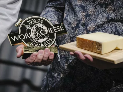 A photograph taken on November 13, 2025 shows the World Cheese Awards first prize winner, a Gruyere AOP special over 18 months cheese presented by Swiss cheese maker Hitz Pius, from the Vorderfultigen cheese company, during the 37th edition of the World Cheese Awards, organised by the Guild of Fine Food, in Bern, Switzerland. With up to 5000 participating cheeses from around 50 countries, the World Cheese Awards is the biggest cheese event in the world. An international jury of around 250 people assesses various aspects of the cheeses, such as the appearance of the rind and paste, as well as the aroma and texture of the cheese.,Image: 1052240351, License: Rights-managed, Restrictions:, Model Release: no