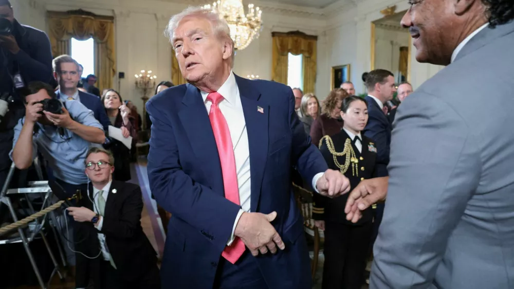 FILE PHOTO: U.S. President Donald Trump walks after shaking hands with Bruce LeVell following the signing of an executive order on "Fostering the Future" in the East Room of the White House, in Washington, D.C., U.S., November 13, 2025. REUTERS/Jonathan Ernst/File Photo
