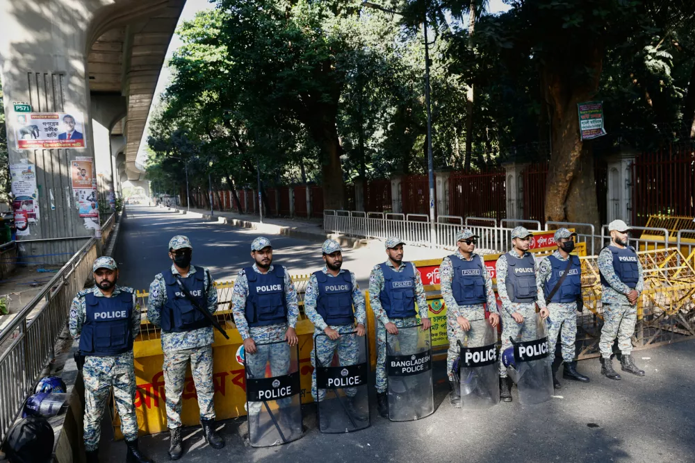 Policemen stand guard outside International Crimes Tribunal after security has been beefed up across the country ahead of an expected verdict against ousted Prime Minister Sheikh Hasina, in Dhaka, Bangladesh, Monday, Nov. 17, 2025. (AP Photo/Rajib Dhar)
