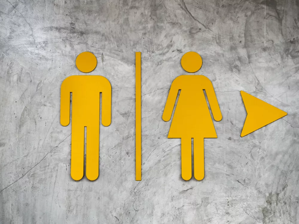 Male and Female Restroom sign on Polished wall