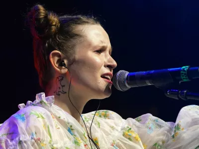 Russian pop icon Elizaveta Andreevna Gyrdymova aka Monetochka performs in front of more than a thousand fans, mainly Ukrainians and Belarusians, during an anti-war concert in Warsaw, Poland, on April 21, 2022. Russian rapper Noize MC and his touring partner Monetochka have raised more than 200,000 euros for a Polish charity helping refugees with their concert series titled "Voices of Peace.",Image: 686113875, License: Rights-managed, Restrictions: TO GO WITH AFP STORY by Ola CICHOWLAS, Model Release: no