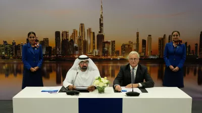 Sheikh Ahmed bin Saeed Al Maktoum, the chairman and chief executive of Emirates and chairman of FlyDubai speaks as Airbus' CEO of commercial aircraft Christian Scherer, right, looks on at a press conference to announce an order for 150 Airbus A321neo aircraft at the Dubai Air Show, United Arab Emirates, Tuesday, Nov. 18, 2025. (AP Photo/Altaf Qadri)
