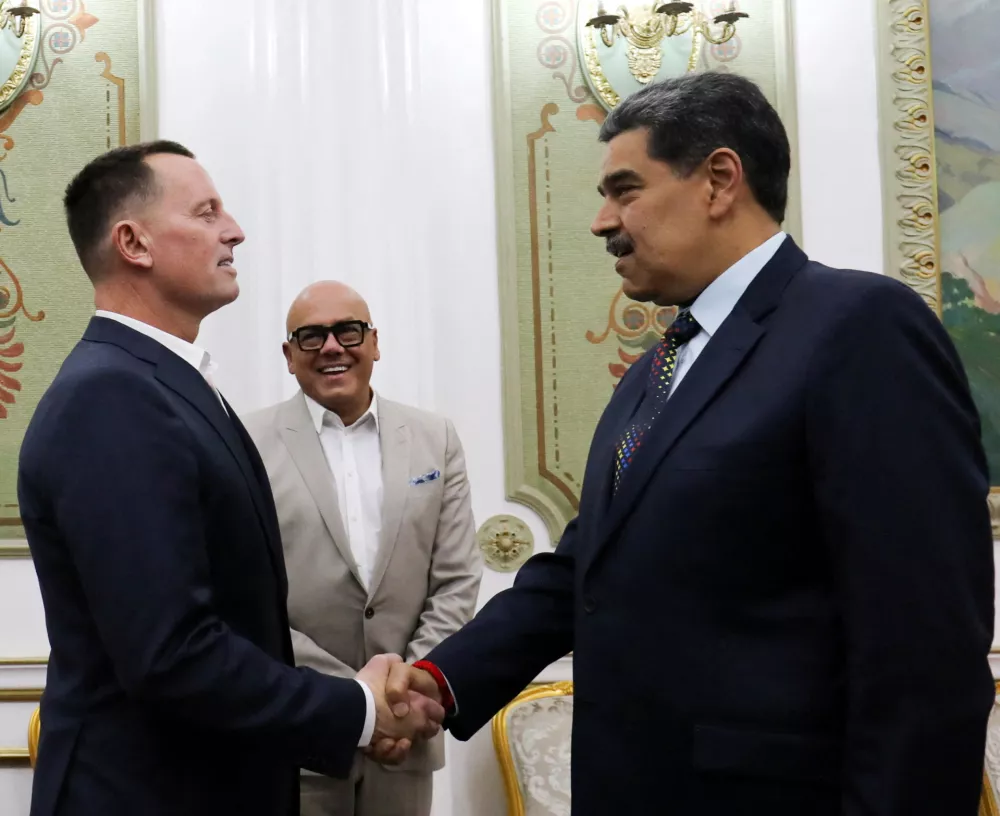 FILE PHOTO: Venezuela's President Nicolas Maduro and U.S. President Donald Trump's envoy Richard Grenell shake hands at the Miraflores Palace, in Caracas, Venezuela January 31, 2025. Miraflores Palace/Handout via REUTERS ATTENTION EDITORS - THIS IMAGE HAS BEEN SUPPLIED BY A THIRD PARTY/File Photo