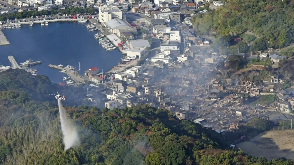 Smoke rises from the site where a massive fire blazed through more than 170 buildings, as seen from a helicopter, in Oita, Oita Prefecture, southwestern Japan, November 19, 2025, in this photo taken by Kyodo. Mandatory credit Kyodo/via REUTERS ATTENTION EDITORS - THIS IMAGE HAS BEEN SUPPLIED BY A THIRD PARTY. MANDATORY CREDIT. JAPAN OUT. NO COMMERCIAL OR EDITORIAL SALES IN JAPAN.   TPX IMAGES OF THE DAY