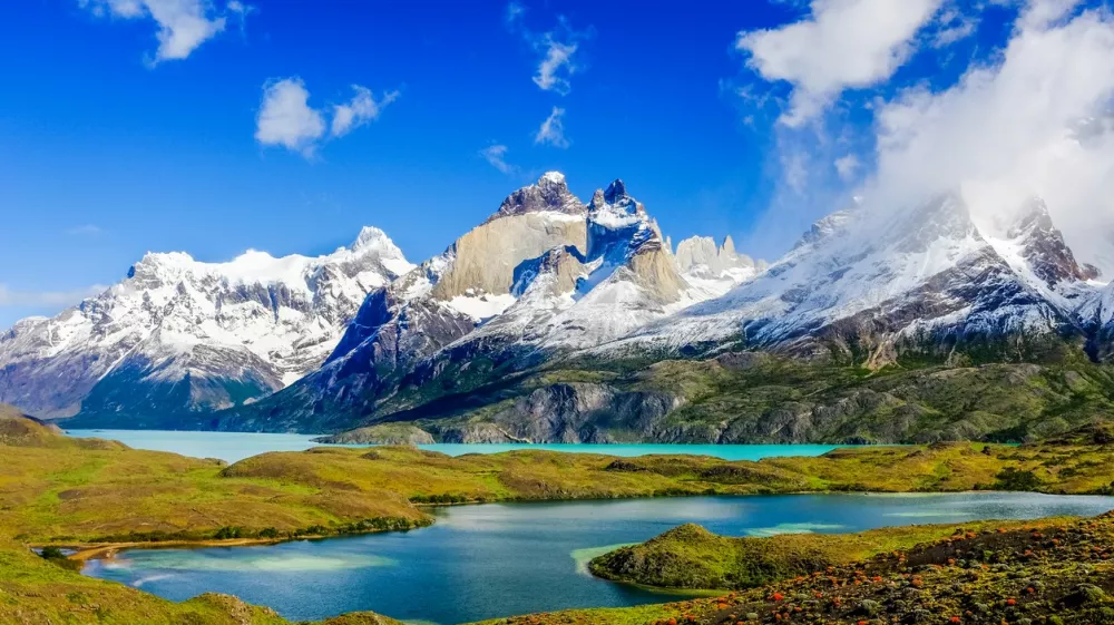 Beautiful Patagonia landscape of Andes mountain range, winding road and lake at Torres del Paine National Park, Chile.