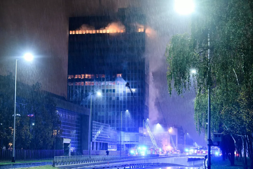 Firefighters work to extinguish the fire that caught 'Vjesnik' skyscraper, which used to accommodate most of Croatian media companies, in Zagreb, Croatia, early Tuesday, Nov. 18, 2025. (AP Photo/Damir Krajac)
