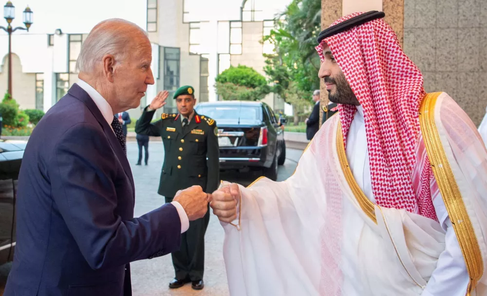 Saudi Crown Prince Mohammed bin Salman fist bumps U.S. President Joe Biden upon his arrival at Al Salman Palace, in Jeddah, Saudi Arabia, July 15, 2022. Bandar Algaloud/Courtesy of Saudi Royal Court/Handout via REUTERS ATTENTION EDITORS - THIS PICTURE WAS PROVIDED BY A THIRD PARTY   TPX IMAGES OF THE DAY - RC2GCV9A9TIQ