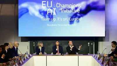 France's President Emmanuel Macron addresses investors next to German chancellor Friedrich Merz and Managing director and Head of Europe at General Catalyst Jeannette zu F&uuml;rstenberg at the EU AI Champions Initiative at a summit on Europe's technological sovereignty, in the EUREF Campus in Berlin, Germany, November 18, 2025. JOHN MACDOUGALL/Pool via REUTERS