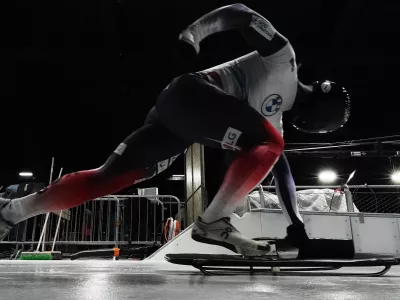 South Korea's Jung Seunggi takes the start at a training session ahead of a three day skeleton and bobsled World Cup stage and Olympic test event in Cortina D'Ampezzo, Italy, Wednesday, Nov. 19, 2025. (AP Photo/Andrew Medichini)