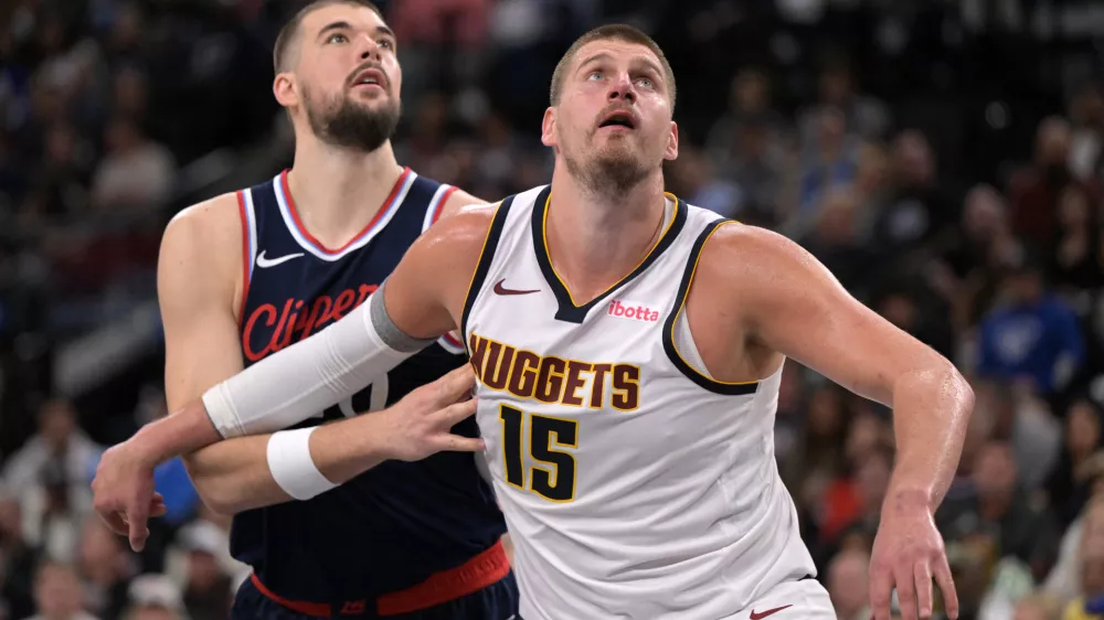 Apr 26, 2025; Inglewood, California, USA; Denver Nuggets center Nikola Jokic (15) and Los Angeles Clippers center Ivica Zubac (40) looks for a rebound in the second half of game four of round one of the 2024 NBA Playoffs at Intuit Dome. Mandatory Credit: Jayne Kamin-Oncea-Imagn Images