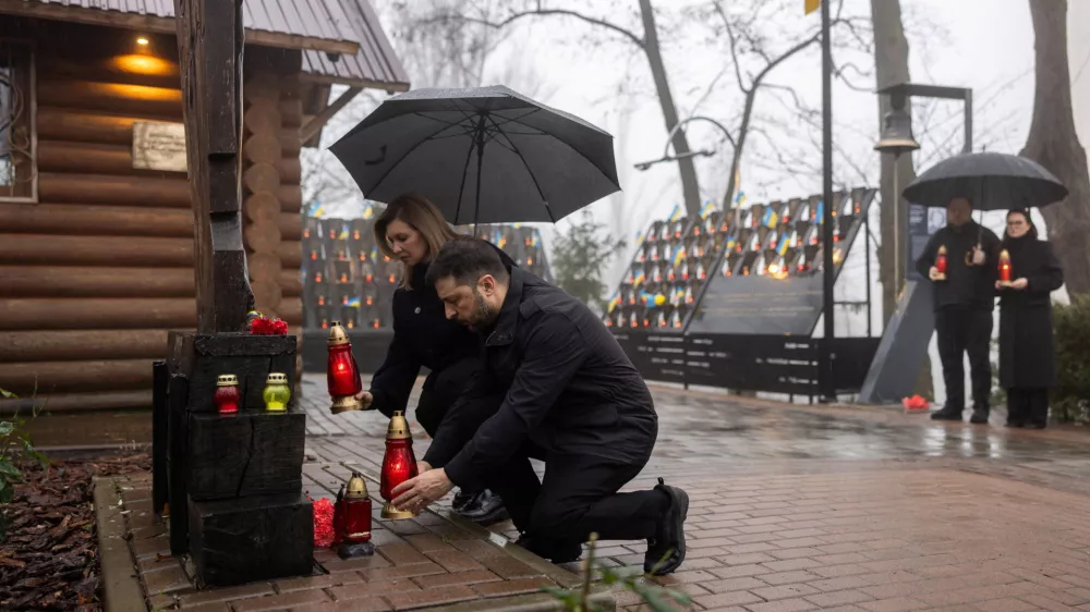 Ukraine's President Volodymyr Zelenskiy and his wife Olena attend a commemoration ceremony at a monument to the so-called "Heavenly Hundred", the people killed during the Ukrainian pro-European Union (EU) mass demonstrations in 2014, to mark the 12th anniversary of the start of the uprising, amid Russia's attack on Ukraine, in Kyiv, Ukraine November 21, 2025. Ukrainian Presidential Press Service/Handout via REUTERS ATTENTION EDITORS - THIS IMAGE HAS BEEN SUPPLIED BY A THIRD PARTY.