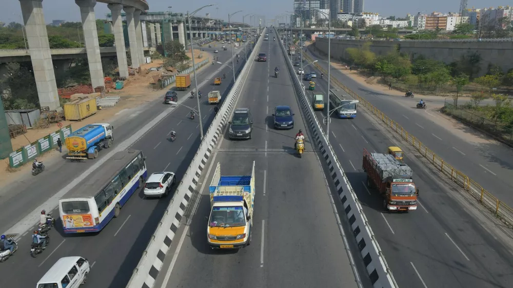 Vehicles drive along a road in Bangalore on March 25, 2021 as India recorded more than 50,000 new coronavirus cases for the first time since November while a new wave of infections took hold a year after one of the world's tightest Covid-19 lockdowns was imposed.,Image: 601049491, License: Rights-managed, Restrictions:, Model Release: no