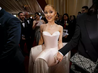 Ariana Grande makes her way along the red carpet during the Oscars arrivals at the 97th Academy Awards in Hollywood, Los Angeles, California, U.S., March 2, 2025. REUTERS/Mike Blake