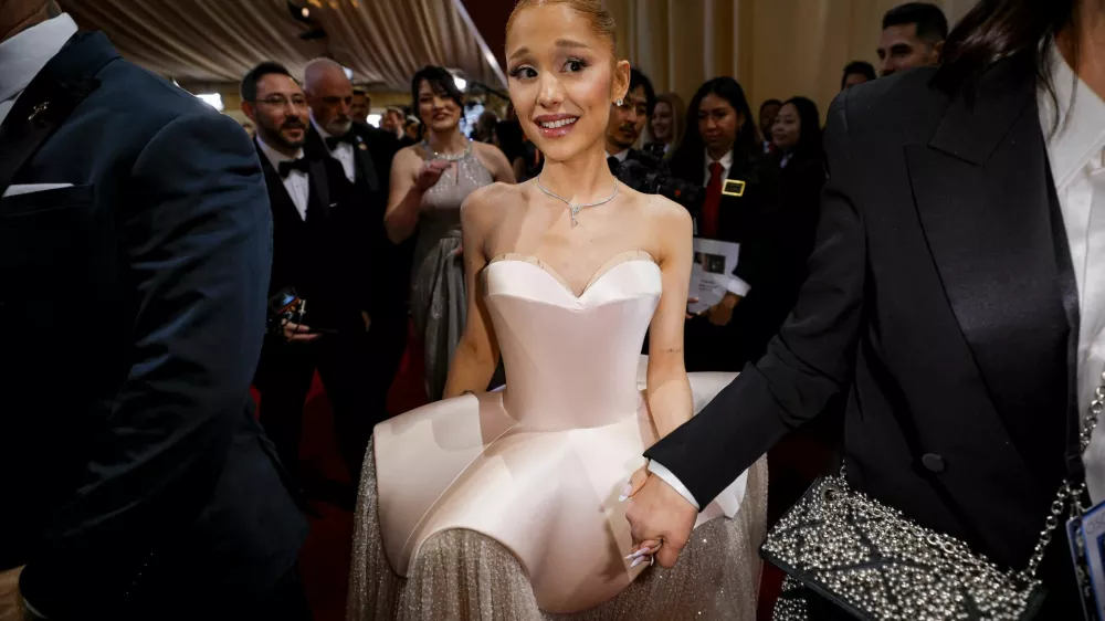 Ariana Grande makes her way along the red carpet during the Oscars arrivals at the 97th Academy Awards in Hollywood, Los Angeles, California, U.S., March 2, 2025. REUTERS/Mike Blake