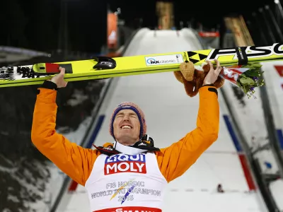 Germany's Severin Freund poses after winning the mens' Large Hill Individual competition at the Nordic Skiing World Championships in Falun, Sweden, Thursday, Feb. 26, 2015. (AP Photo/Matthias Schrader)