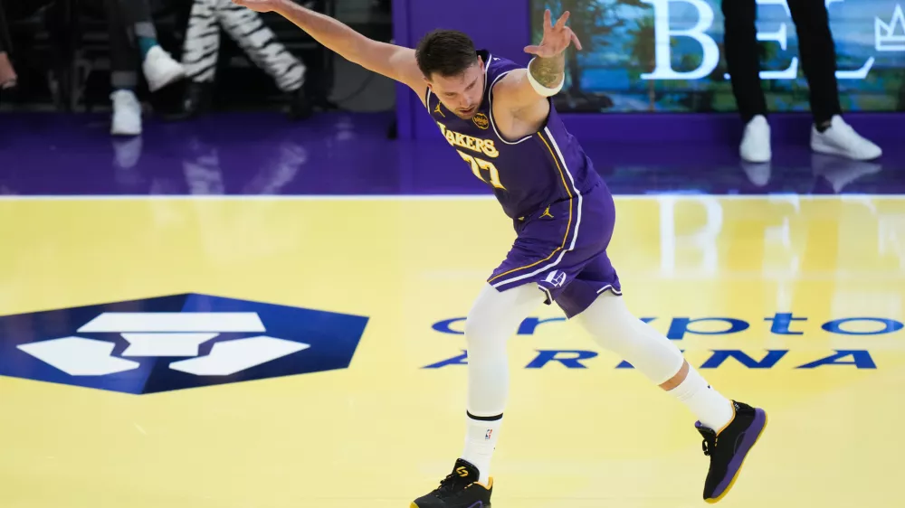 Los Angeles Lakers guard Luka Doncic celebrates his three-point basket during the first half of an NBA Cup basketball game against the Los Angeles Clippers Tuesday, Nov. 25, 2025, in Los Angeles. (AP Photo/Jae C. Hong)