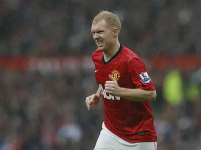 Manchester United's Paul Scholes runs during the English Premier League soccer match against Swansea City at Old Trafford stadium in Manchester, northern England May 12, 2013. Scholes will quit playing at the end of the Premier League season, the Manchester United midfielder said on Saturday. REUTERS/Phil Noble (BRITAIN - Tags: SPORT SOCCER) FOR EDITORIAL USE ONLY. NOT FOR SALE FOR MARKETING OR ADVERTISING CAMPAIGNS. EDITORIAL USE ONLY. NO USE WITH UNAUTHORIZED AUDIO, VIDEO, DATA, FIXTURE LISTS, CLUB/LEAGUE LOGOS OR 'LIVE' SERVICES. ONLINE IN-MATCH USE LIMITED TO 45 IMAGES, NO VIDEO EMULATION. NO USE IN BETTING, GAMES OR SINGLE CLUB/LEAGUE/PLAYER PUBLICATIONS.