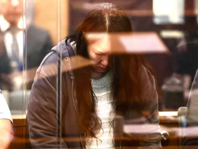 FILE - Hakyung Lee stands in the dock at the High Court in Auckland, New Zealand, on Sept. 8, 2025. (Lawrence Smith/Stuff Pool Photo via AP, File)