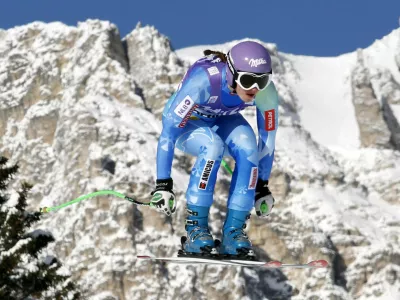 Tina Maze of Slovenia goes airborne during the second training session in the women's downhill event at the Alpine Skiing World Cup in Cortina d'Ampezzo January 18, 2013. REUTERS/Giampiero Sposito (ITALY - Tags: SPORT SKIING)