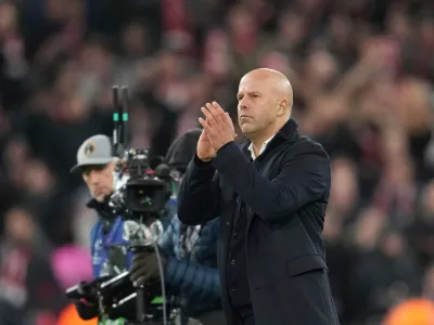 Liverpool's manager Arne Slot applauds after the Champions League opening phase soccer match between Liverpool and PSV in Liverpool, England, Wednesday, Nov. 26, 2025. (AP Photo/Jon Super)