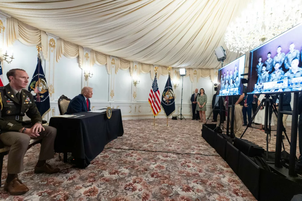 President Donald Trump speaks to troops via video from his Mar-a-Lago estate on Thanksgiving, Thursday, Nov. 27, 2025, in Palm Beach, Fla. (AP Photo/Alex Brandon)