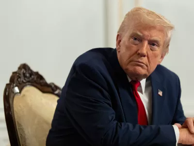 President Donald Trump speaks to reporters after speaking to troops via video from his Mar-a-Lago estate on Thanksgiving, Thursday, Nov. 27, 2025, in Palm Beach, Fla. (AP Photo/Alex Brandon)
