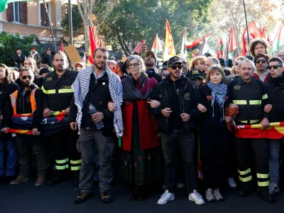 Francesca Albanese, the United Nations special rapporteur on the situation of human rights in the occupied Palestinian territory, and Swedish activist Greta Thunberg attend a demonstration during a nationwide strike, called by the USB union, in solidarity with Gaza and against the government and its plan to increase military spending, in Rome, Italy, November 29, 2025. REUTERS/Remo Casilli