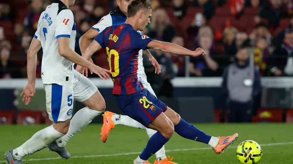 Barcelona's Dani Olmo scores his side's third goal during a Spanish La Liga soccer match between Barcelona and Alaves, in Barcelona, Spain, Saturday, Nov. 29, 2025. (AP Photo/Joan Monfort)
