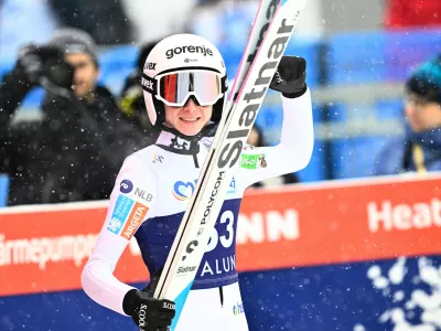 Slovenia's Nika Prevc celebrates winning the Women's Ski Jumping World Cup, large hill, at Lugnet Stadium in Falun, Sweden, Sunday Nov. 30, 2025. (Fredrik Sandberg/TT via AP)