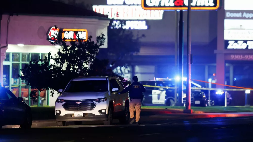 A police officer checks a vehicle after several people were shot at a family gathering in Stockton, California, U.S. November 29, 2025. REUTERS/Fred Greaves