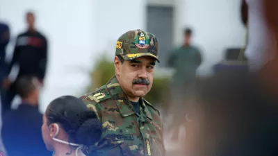 FILE PHOTO: Venezuela's President Nicolas Maduro attends a rally against a possible escalation of U.S. actions toward the country, at Fort Tiuna military base in Caracas, Venezuela, November 25, 2025. REUTERS/Leonardo Fernandez Viloria/File Photo