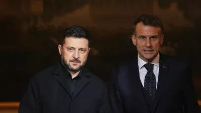 French President Emmanuel Macron, right, and Ukrainian President Volodymyr Zelenskyy arrive to give a joint press conference at the Elysee Palace in Paris, Monday, Dec 1, 2025. (AP Photo/Christophe Ena, Pool)