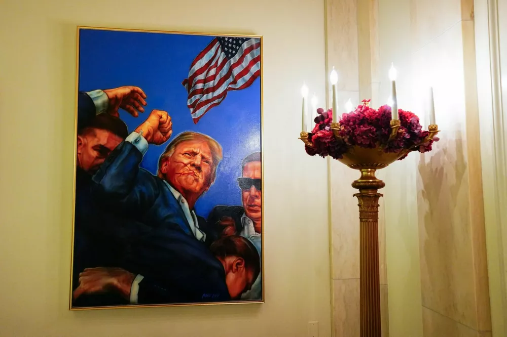 A painting of the attempted assassination of U.S. President Trump in the Grand Foyer of the White House during a media preview of the 2025 holiday decorations at the White House in Washington, U.S., December 1, 2025. REUTERS/Aaron Schwartz