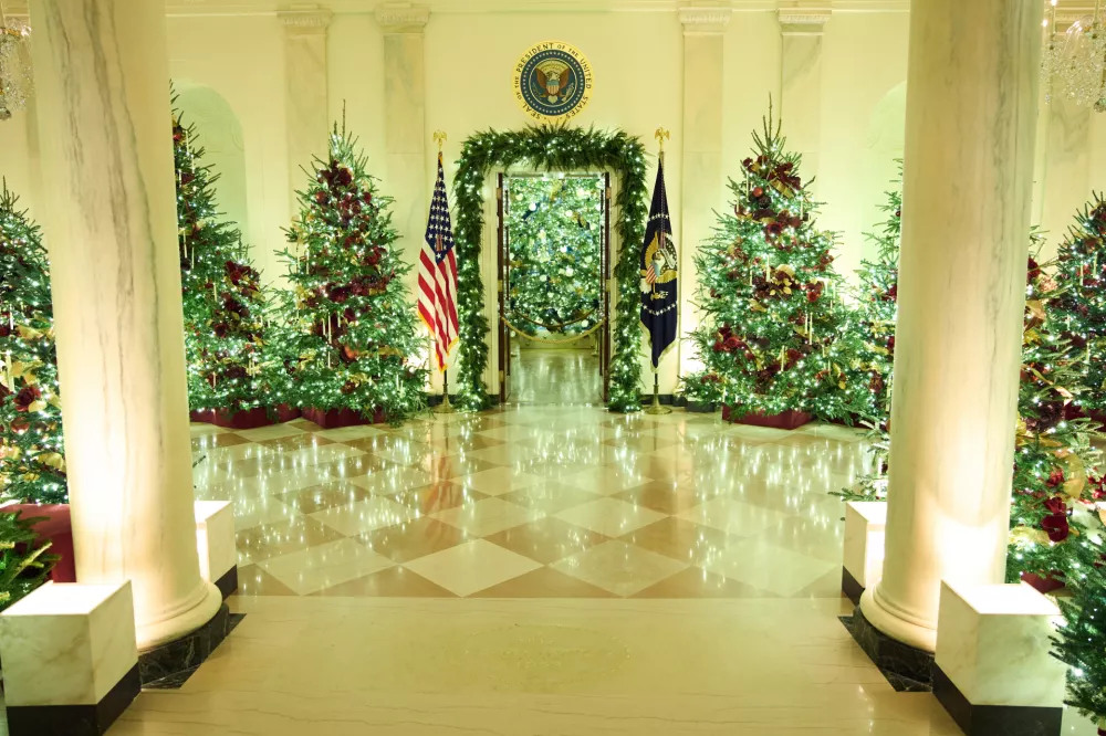 Christmas trees decorate the Cross Hall of the White House during a press preview of the Christmas decorations "Home is Where the Heart Is," Monday, Dec. 1, 2025, in Washington. (AP Photo/Evan Vucci)