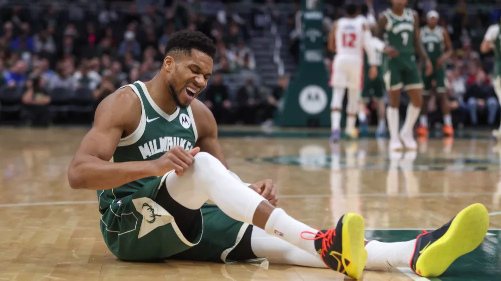 Milwaukee Bucks' Giannis Antetokounmpo reacts after suffering an injury during the first half an NBA basketball game against the Detroit Pistons, Wednesday, Dec. 3, 2025, in Milwaukee. (AP Photo/Kylie Bridenhagen)