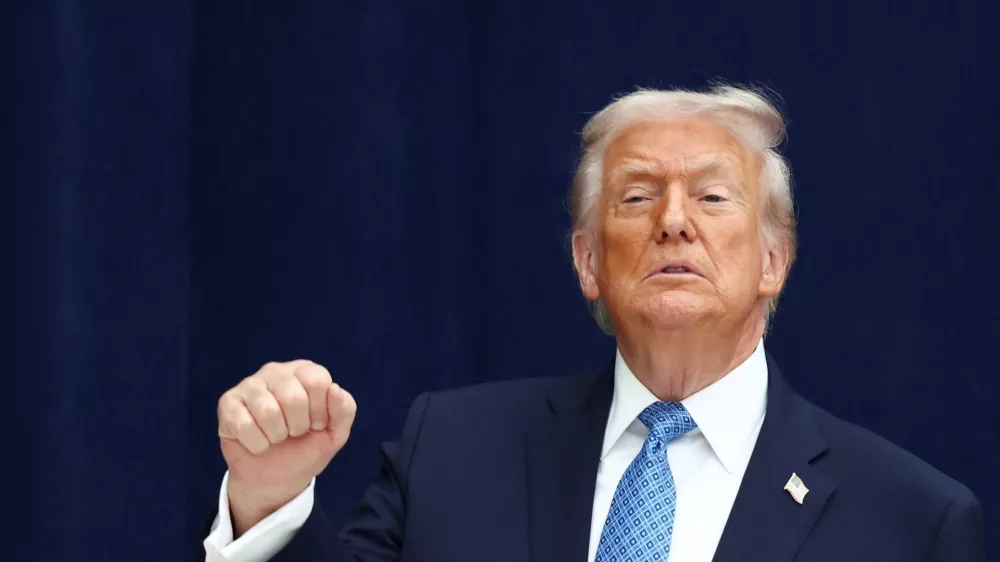 U.S. President Donald Trump gestures during a signing ceremony with President of the Democratic Republic of the Congo Felix Tshisekedi and President of Rwanda Paul Kagame at the U.S. Institute of Peace in Washington, D.C., U.S., December 4, 2025. REUTERS/Kevin Lamarque