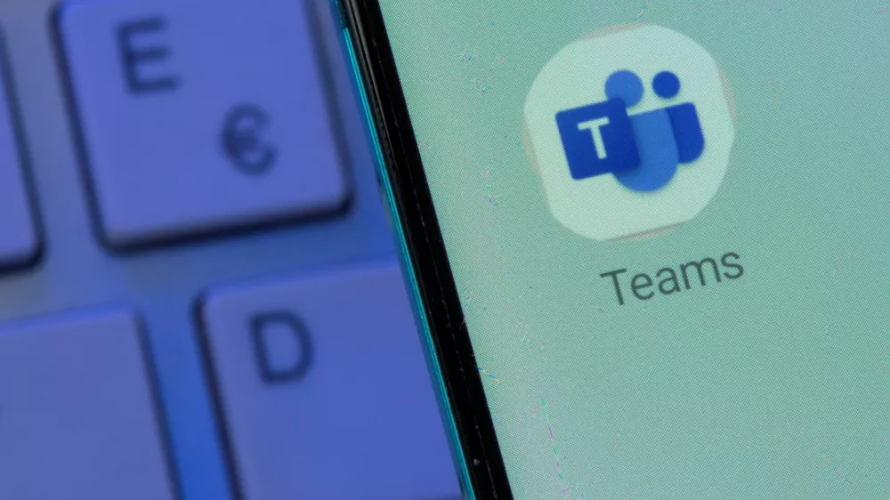 FILE PHOTO: Microsoft Teams app is seen on the smartphone placed on the keyboard in this illustration taken, July 26, 2021. REUTERS/Dado Ruvic/Illustration/File Photo