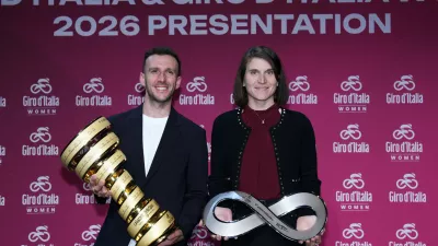 Elisa Longo Borghini and Simon Yateshold trophies during the presentation of the 2026 Giro d'Italia man and women in Rome, Italy, Dec. 1, 2025. (Massimo Paolone/LaPresse via AP)