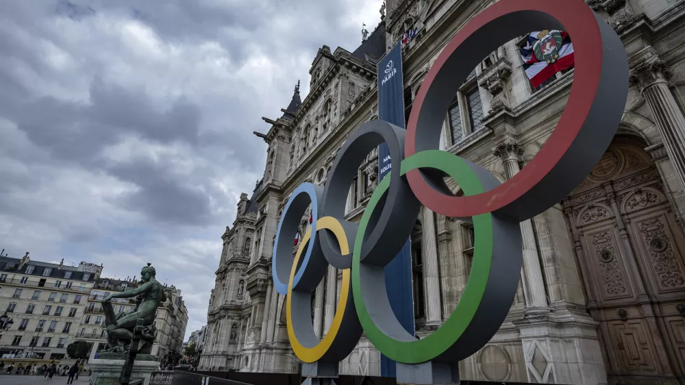 FILE - The Olympic rings are seen in front of the Paris City Hall, in Paris, on April 30, 2023. Paris City Hall said Wednesday Feb. 28, 2024 that no policing plans for the upcoming Olympic Games were lost in the theft of computer gear reported by one of its employees. (AP Photo/Aurelien Morissard, File)