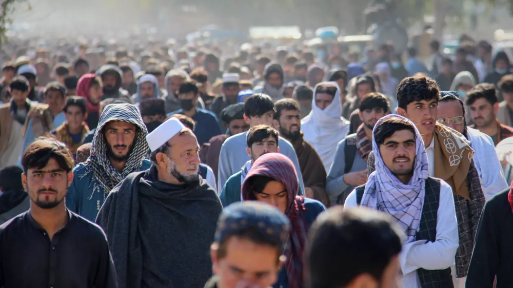 A crowd leaves a stadium after attending the public execution, carried out by Taliban authorities, of a man sentenced by the Supreme Court for killing 13 members of a family, including children, earlier this year, in the eastern city of Khost, eastern Afghanistan, Tuesday, Dec. 2, 2025. (AP Photo/Saifullah Zahir)