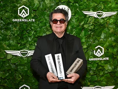 Jafar Panahi poses with the awards for best international feature, best original screenplay and best director at The Gotham Film Awards at Cipriani Wall Street on Monday, Dec. 1, 2025, in New York. (Photo by Evan Agostini/Invision/AP)