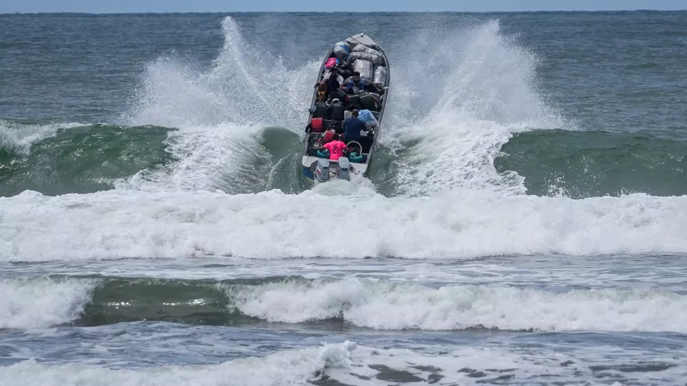 Venezuelan migrants depart Jaque on Panama's Pacific coast en route to Jurado, Colombia, as they return home after failing to enter the United States, Sept. 19, 2025. (AP Photo/Matias Delacroix, File)