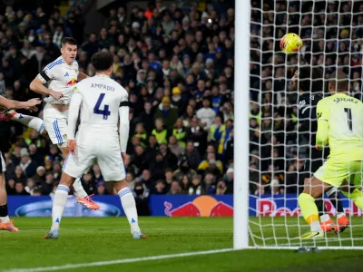 Leeds United's Jaka Bijol, third right, scores his sides first goal of the game during the English Premier League soccer match between Leeds United and Chelsea in Leeds, England, Wednesday Dec. 3, 2025. (Mike Egerton/PA via AP)
