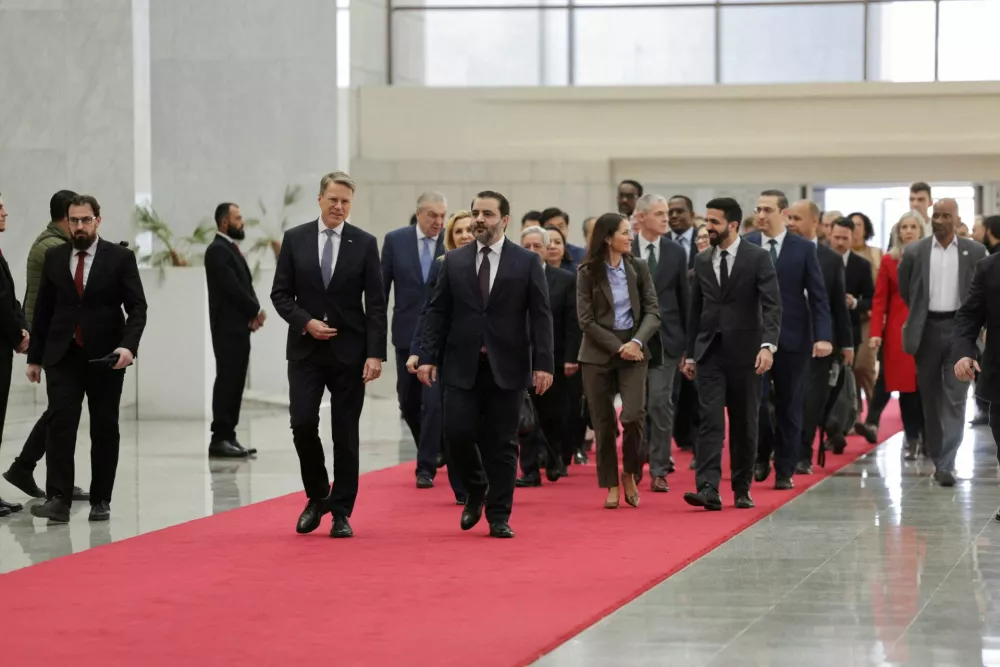 Slovenia's Ambassador to the United Nations, Samuel Zbogar, walks with Syria's Foreign Minister Asaad al-Shaibani and members of United Nations Security Council as they arrive to meet with Syrian President Ahmed al-Sharaa at the People's Palace in Damascus, Syria, December 4, 2025. REUTERS/Khalil Ashawi