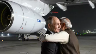Russian President Vladimir Putin, left, and Indian Prime Minister Narendra Modi embrace each other at the Palam Air Base in New Delhi, India, on Thursday, Dec. 4, 2025. (Grigory Sysoyev, Sputnik, Kremlin Pool Photo via AP)