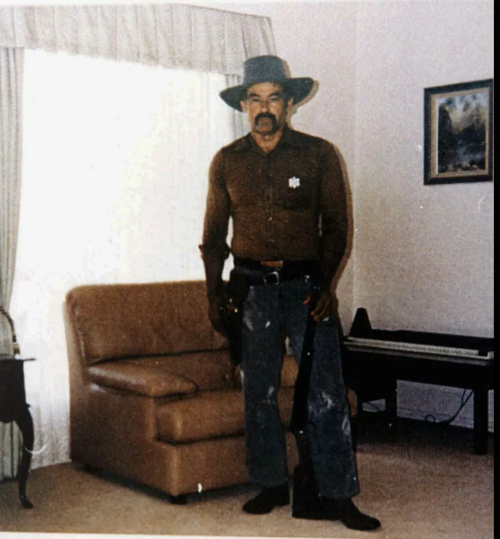 FILE--Ivan Milat, the man convicted of the deaths of 7 backpackers, is shown in this undated photo. Milat is shown in his suburban Sydney home wearing a cowboy outfit complete with a hand gun and a rifle. (AP Photo/HO)