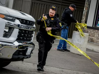 Investigators with the San Joaquin Sheriff's Department remove crime scene tape at Thornton Blvd. and Lucile Ave., where a mass shooting took place Saturday in a banquet hall in Stockton, Calif., Sunday, Nov. 30, 2025. (Bront&euml; Wittpenn/San Francisco Chronicle via AP)